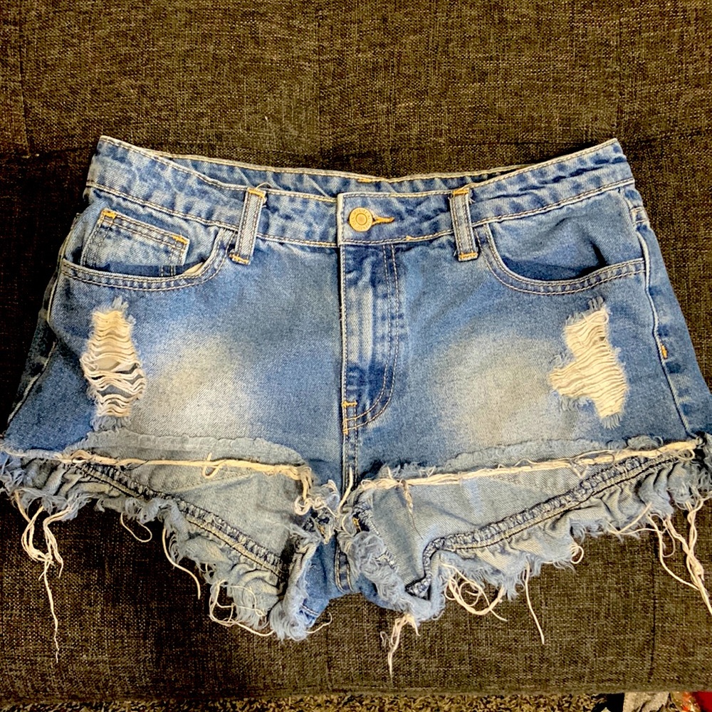 Litz premium denim brand. Blue Jean short shorts. Frayed.